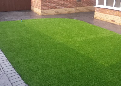 imprinted concrete with artificial grass