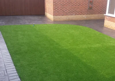 imprinted concrete with artificial grass