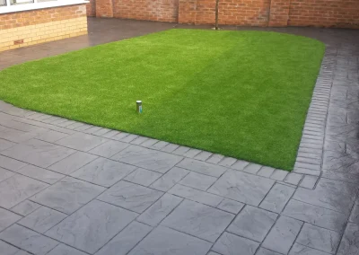 imprinted concrete with artificial grass