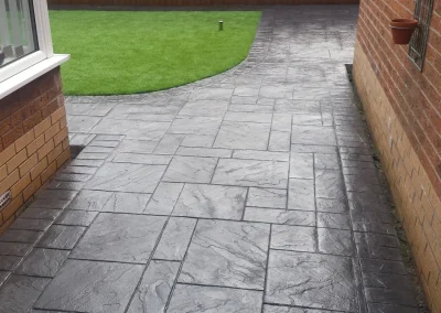 imprinted concrete with artificial grass